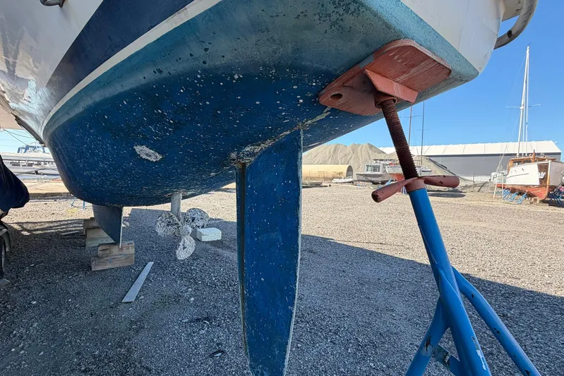 Gratitude Yacht Photos Pics Bottom view of a 2015 Leopard 48 sailboat on dry dock, showing keel and propeller.