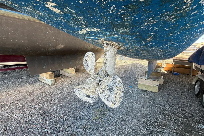 Gratitude Yacht Photos Pics Barnacle-covered propeller of a 2015 Leopard 48 yacht on dry dock.