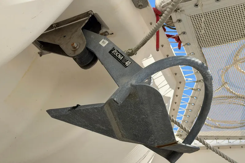 Gratitude Yacht Photos Pics Anchor on a 2015 Leopard 48 yacht, secured with ropes under a clear sky.