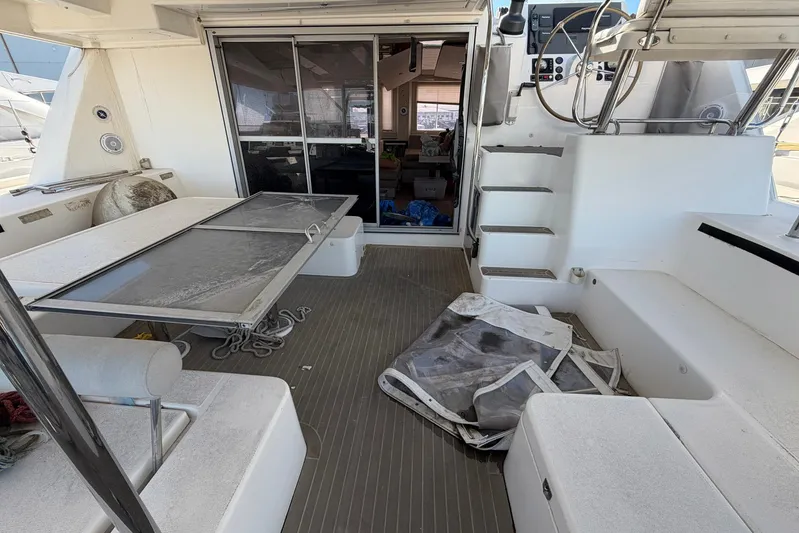Gratitude Yacht Photos Pics Leopard 48 yacht interior, 2015 model, featuring seating, table, and helm station.
