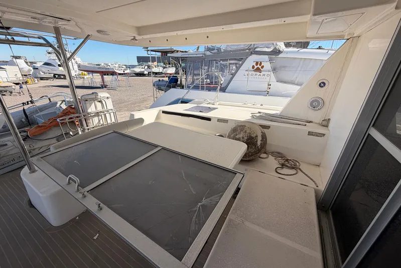 Gratitude Yacht Photos Pics 2015 Leopard 48 yacht deck with storage and equipment, docked in a marina.