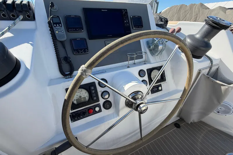 Gratitude Yacht Photos Pics Steering wheel and controls of a 2015 Leopard 48 yacht cockpit.