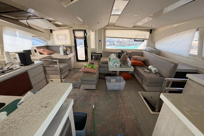 Gratitude Yacht Photos Pics Interior of 2015 Leopard 48 yacht with modern seating and kitchen area.