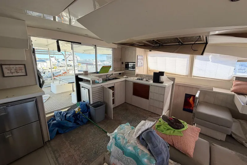 Gratitude Yacht Photos Pics Interior of 2015 Leopard 48 yacht with modern kitchen and outdoor view.