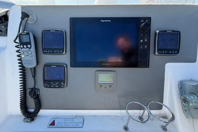 Gratitude Yacht Photos Pics Control panel of a 2015 Leopard 48 yacht with navigation equipment.