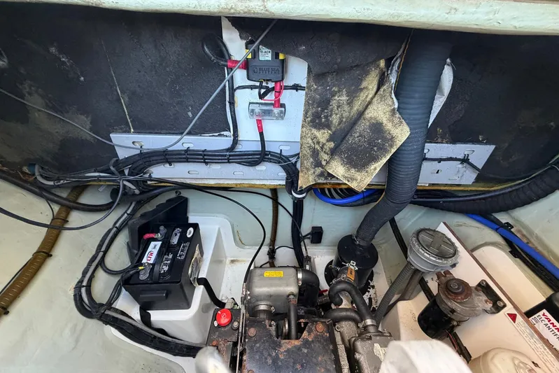 Gratitude Yacht Photos Pics Engine compartment of a 2015 Leopard 48 yacht, featuring battery and wiring.