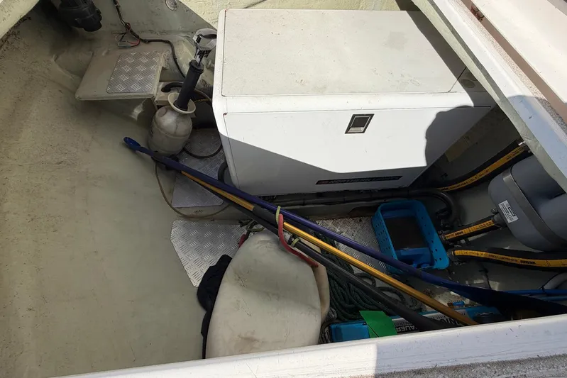 Gratitude Yacht Photos Pics Storage compartment of a 2015 Leopard 48 yacht with equipment and tools.