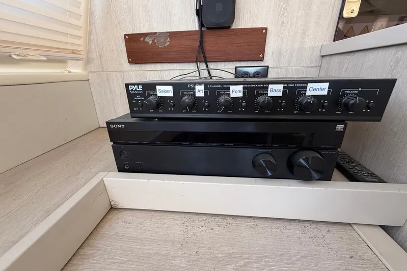 Gratitude Yacht Photos Pics Audio equipment setup in a 2015 Leopard 48 yacht interior.