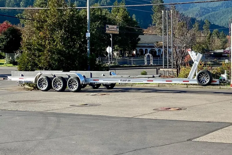 Mi Callao Yacht Photos Pics 2015 Ranger Tugs R-31S trailer parked outdoors on a sunny day.