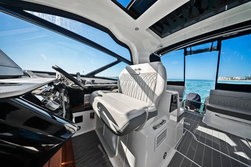  Yacht Photos Pics 2023 Sea Ray Sundancer 370 Outboard interior with luxurious seating and ocean view.