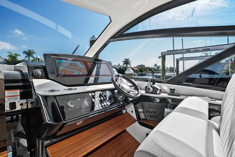  Yacht Photos Pics 2023 Sea Ray Sundancer 370 Outboard helm with modern controls and navigation display.