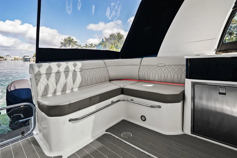  Yacht Photos Pics 2023 Sea Ray Sundancer 370 Outboard interior with elegant seating and scenic water view.