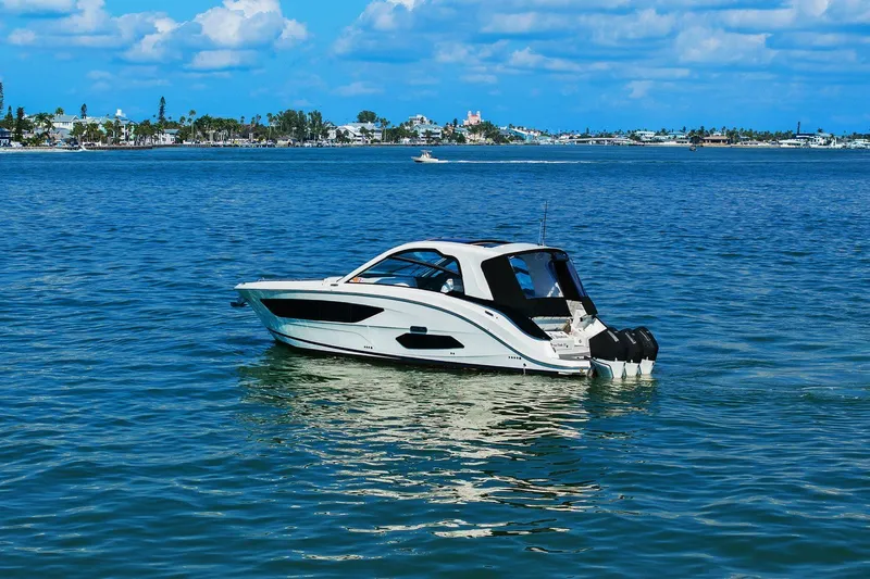  Yacht Photos Pics 2023 Sea Ray Sundancer 370 Outboard cruising on a sunny day in calm waters.