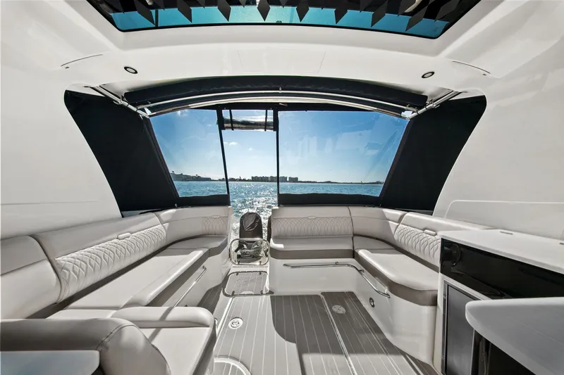  Yacht Photos Pics 2023 Sea Ray Sundancer 370 Outboard interior with luxurious seating and ocean view.
