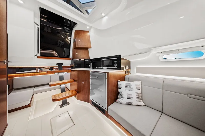  Yacht Photos Pics 2023 Sea Ray Sundancer 370 Outboard interior with modern kitchen and seating area.