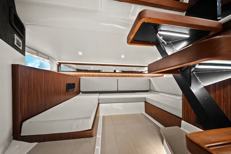  Yacht Photos Pics 2023 Sea Ray Sundancer 370 Outboard interior with modern seating and wooden accents.