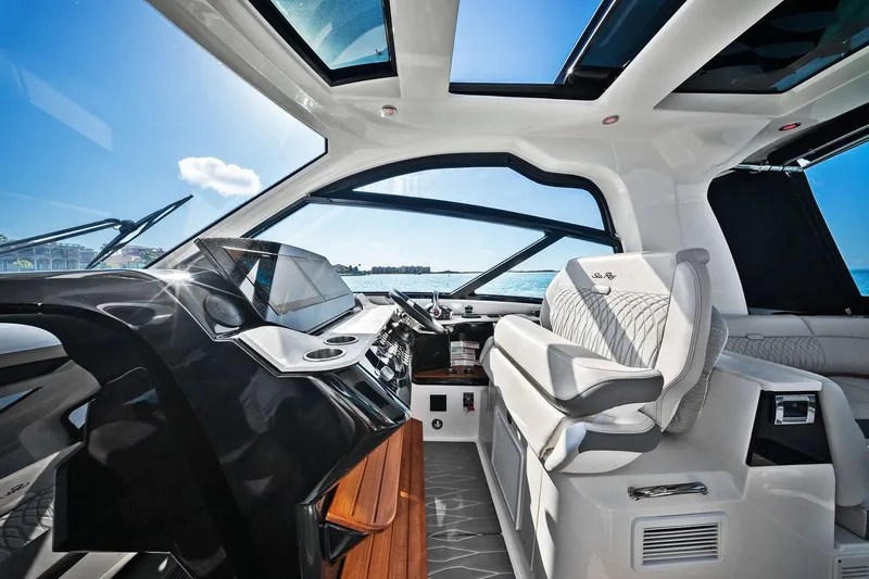  Yacht Photos Pics 2023 Sea Ray Sundancer 370 Outboard interior with modern helm and luxurious seating.
