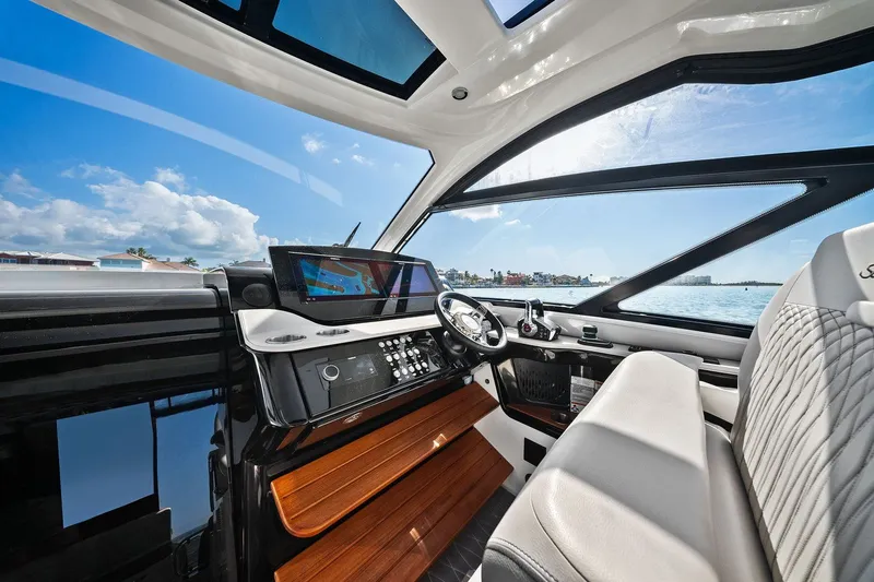  Yacht Photos Pics 2023 Sea Ray Sundancer 370 Outboard helm with modern controls and panoramic windows.