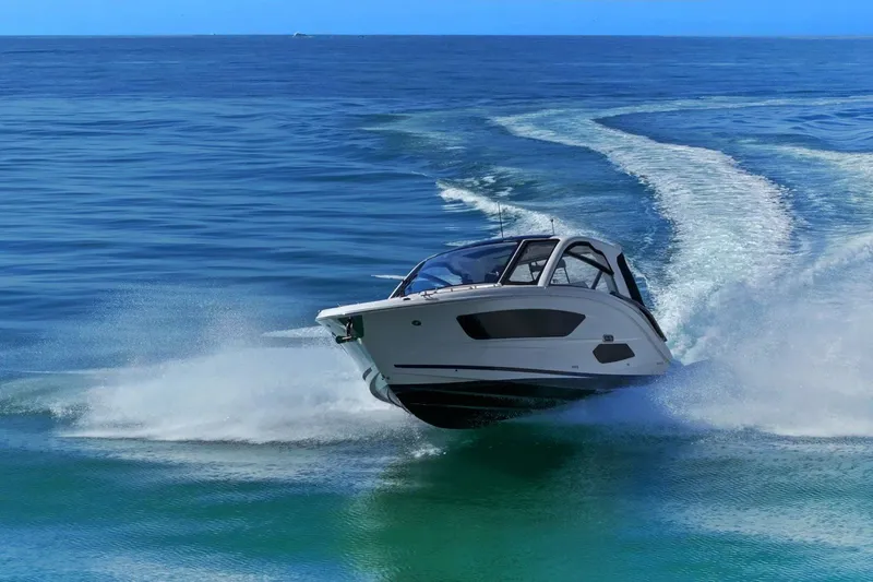 Yacht Photos Pics 2023 Sea Ray Sundancer 370 Outboard cruising on open water, creating a dynamic wake.