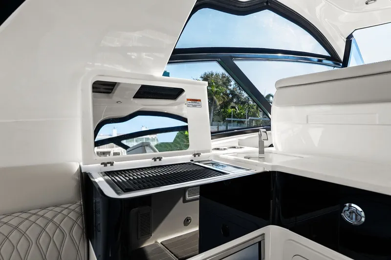  Yacht Photos Pics 2023 Sea Ray Sundancer 370 Outboard interior with sleek kitchen and modern design.