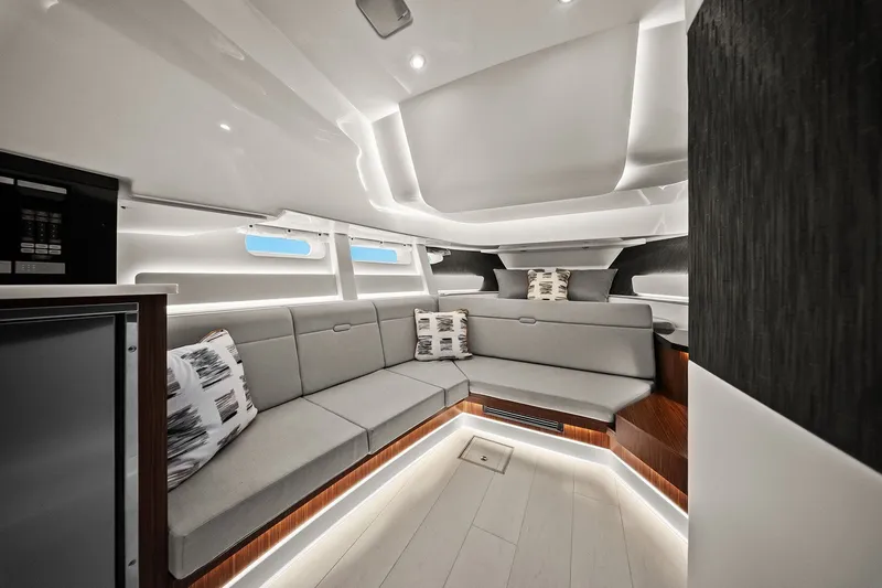 Yacht Photos Pics Luxurious interior of 2023 Sea Ray Sundancer 370 Outboard with modern seating and ambient lighting.