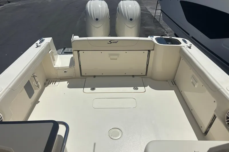  Yacht Photos Pics 2026 Scout 255 Dorado boat deck with dual engines and spacious seating area.