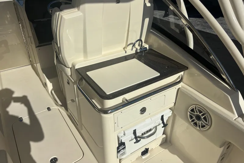  Yacht Photos Pics 2026 Scout 255 Dorado boat interior with sink and storage area.