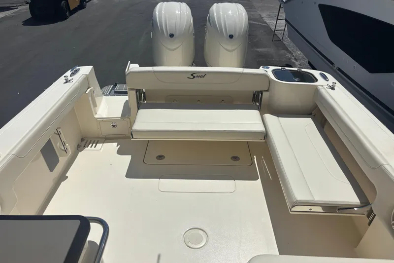  Yacht Photos Pics 2026 Scout 255 Dorado boat interior with seating and dual engines.