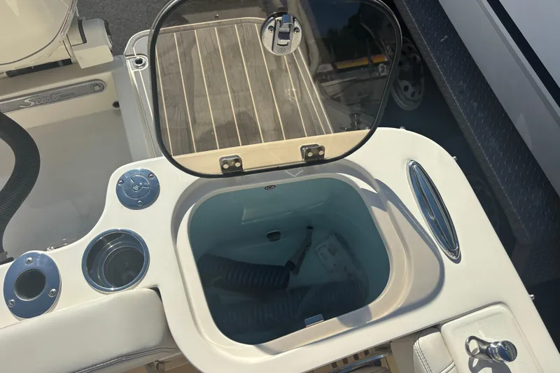 Yacht Photos Pics Livewell compartment on a 2026 Scout 255 Dorado boat, featuring a clear lid and modern design.
