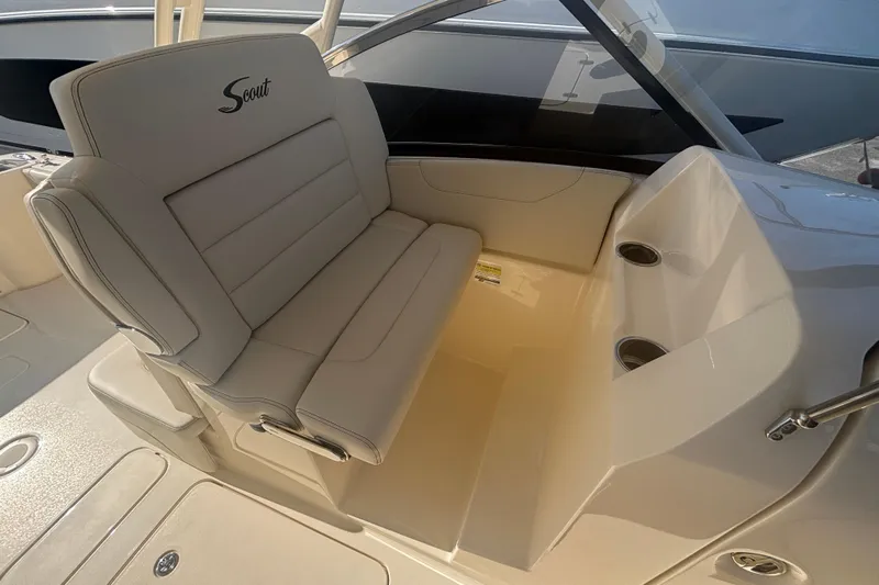 Yacht Photos Pics 2026 Scout 255 Dorado boat interior with beige seating and cup holders.