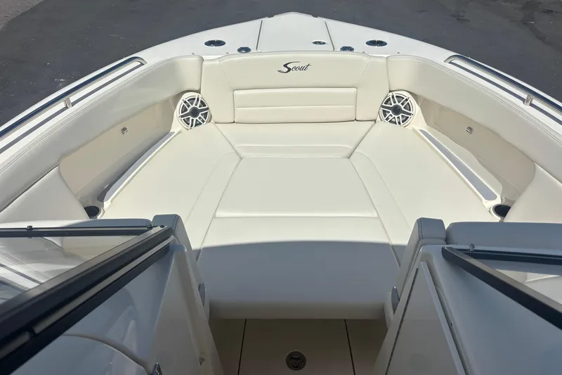  Yacht Photos Pics 2026 Scout 255 Dorado boat interior with white cushioned seating and built-in speakers.