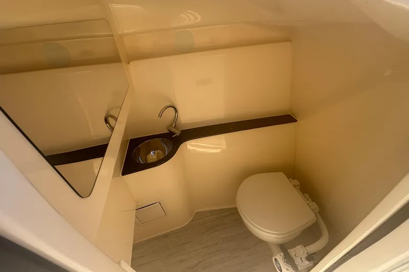  Yacht Photos Pics 2026 Scout 255 Dorado boat interior bathroom with sink and toilet.