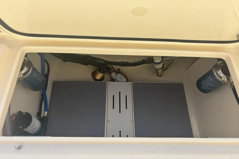  Yacht Photos Pics 2026 Scout 255 Dorado boat compartment with filters and pumps visible.