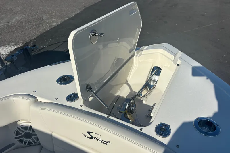 Yacht Photos Pics 2026 Scout 255 Dorado boat anchor compartment with open hatch, showcasing sleek design.