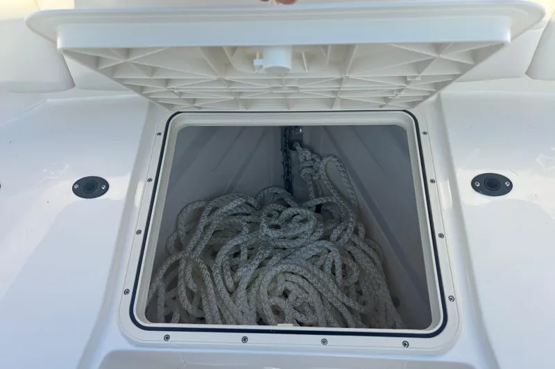  Yacht Photos Pics Open storage compartment on 2026 Scout 255 Dorado boat with coiled rope inside.