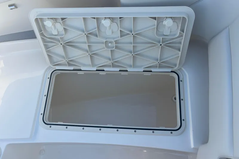  Yacht Photos Pics Open storage compartment on 2026 Scout 255 Dorado boat, showcasing interior space.