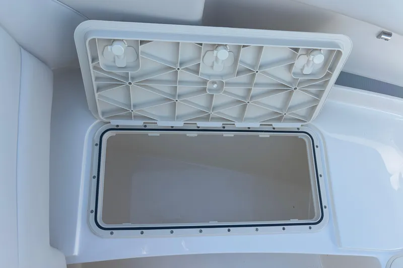  Yacht Photos Pics Open storage compartment on 2026 Scout 255 Dorado boat, showcasing interior space.