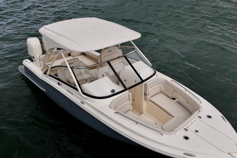  Yacht Photos Pics 2026 Scout 255 Dorado boat on water, featuring sleek design and spacious seating.