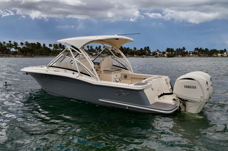  Yacht Photos Pics 2026 Scout 255 Dorado boat with Yamaha engine on water, palm trees in background.