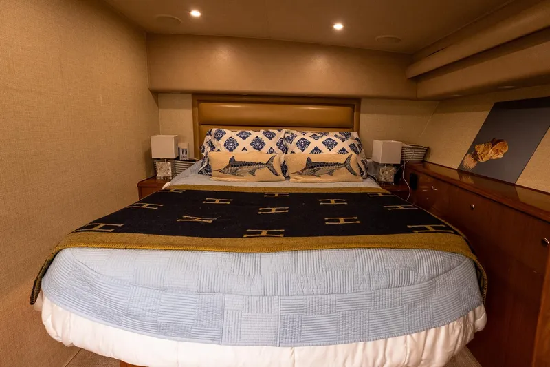 Geaux Time Yacht Photos Pics Luxurious bedroom interior of 2002 Viking 52 Convertible yacht with cozy bedding.