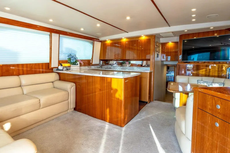 Geaux Time Yacht Photos Pics Luxurious interior of a 2002 Viking 52 Convertible yacht with elegant wood finishes.