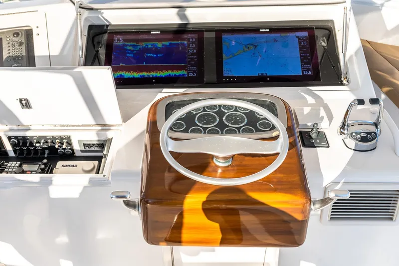 Geaux Time Yacht Photos Pics Cockpit of 2002 Viking 52 Convertible yacht with navigation screens and controls.