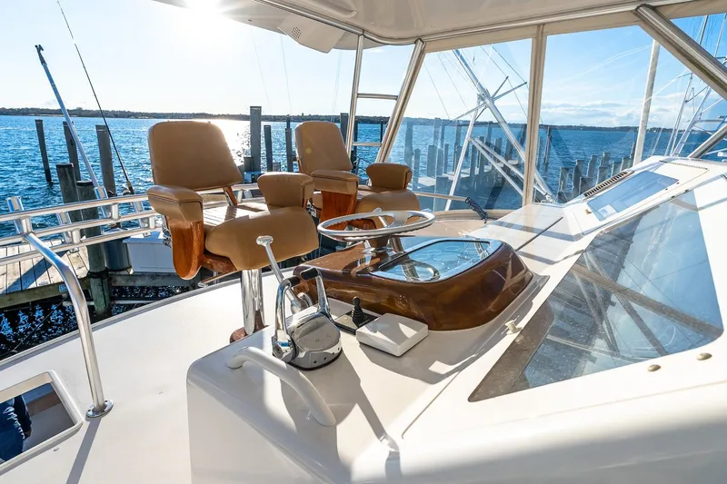 Geaux Time Yacht Photos Pics Helm of 2002 Viking 52 Convertible yacht with ocean view and captain's chairs.