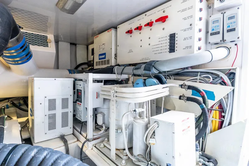 Geaux Time Yacht Photos Pics Engine room of 2002 Viking 52 Convertible yacht with electrical systems and wiring.