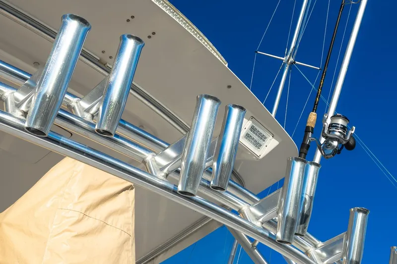 Geaux Time Yacht Photos Pics Fishing rod holders on a 2002 Viking 52 Convertible yacht against a clear blue sky.