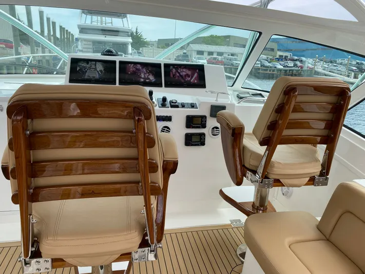 Wendy Ann Yacht Photos Pics 2021 Albemarle 41 Express helm with leather seats and advanced navigation displays.