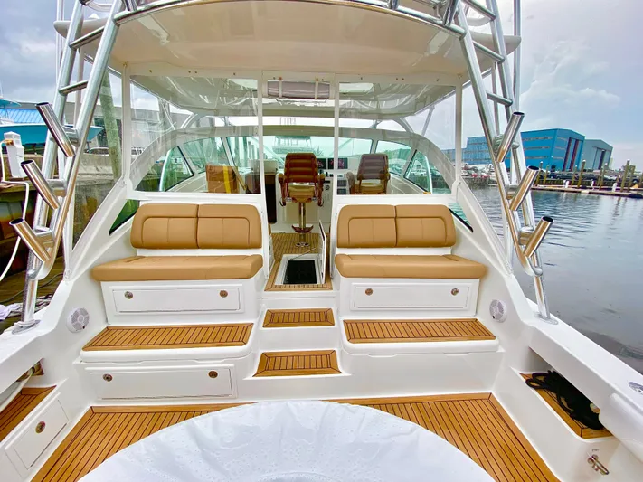 Wendy Ann Yacht Photos Pics 2021 Albemarle 41 Express yacht interior with tan seating and wooden flooring.