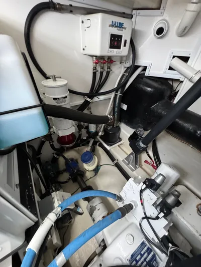 Wendy Ann Yacht Photos Pics Engine room of 2021 Albemarle 41 Express with various mechanical components and wiring.