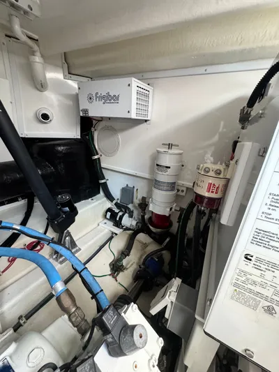 Wendy Ann Yacht Photos Pics Engine room of 2021 Albemarle 41 Express boat with Frigibar unit and various components.