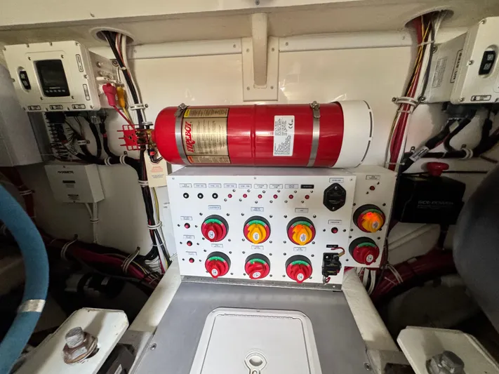 Wendy Ann Yacht Photos Pics Engine room of 2021 Albemarle 41 Express with control panel and fire extinguisher.
